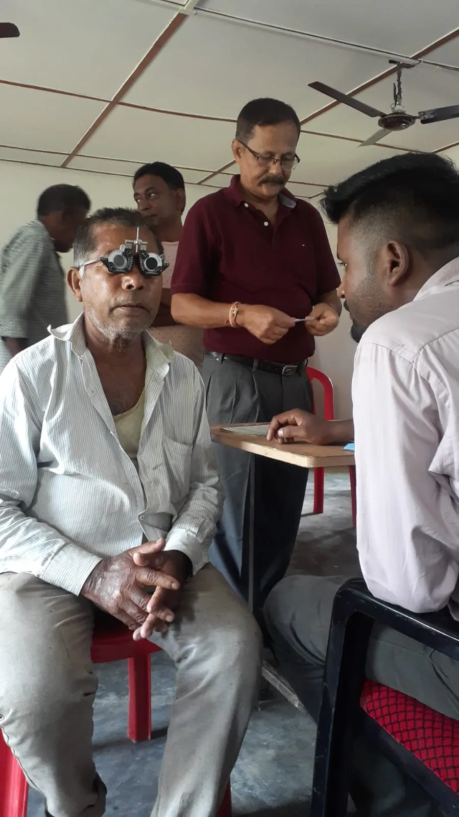 Ophthalmic specialist checking distance vision for a patient.